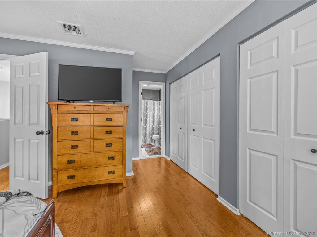 3 Apple Way Madison, CT 06443 - Photo 22 of 31 a view of room with wooden floor and cabinet