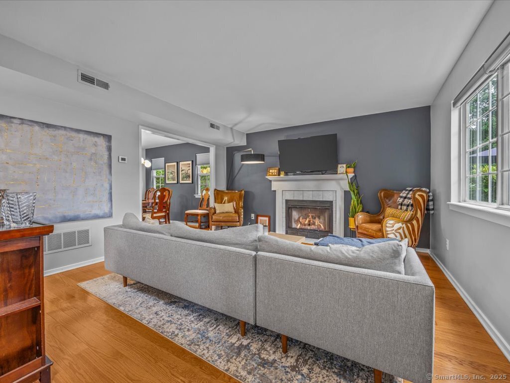 3 Apple Way Madison, CT 06443 - Photo 4 of 31 a living room with furniture and a fireplace