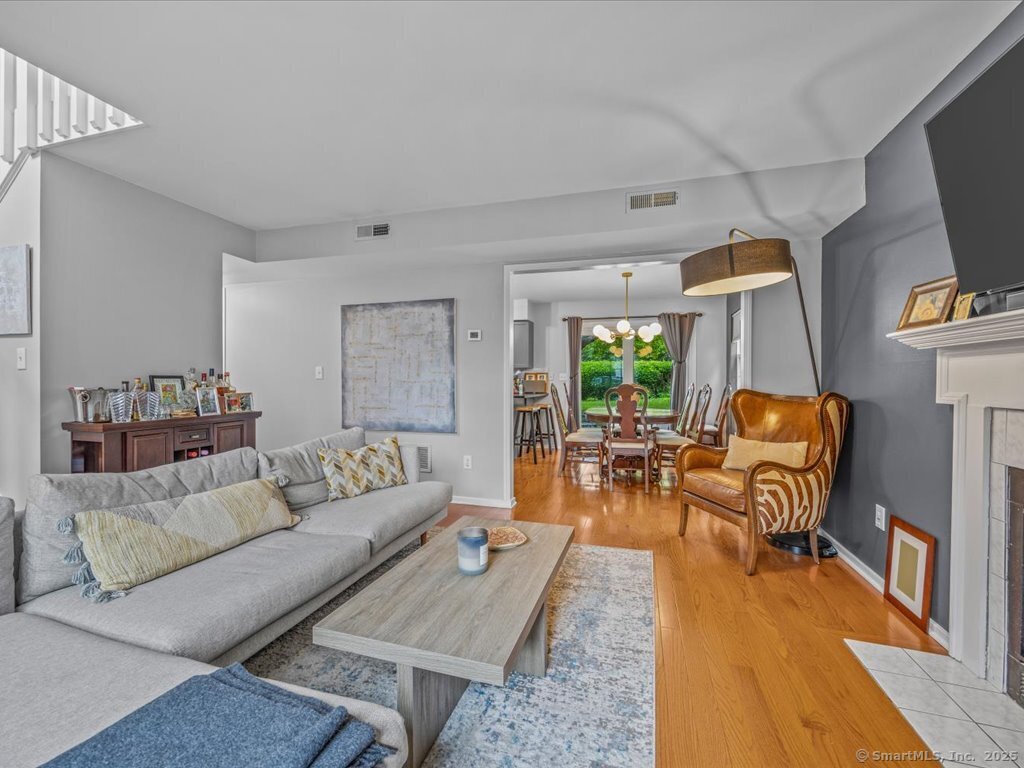 3 Apple Way Madison, CT 06443 - Photo 7 of 31 a living room with furniture and a flat screen tv
