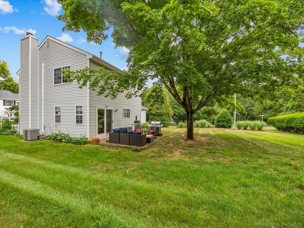 3 Apple Way Madison, CT 06443 - Photo 10 of 31 a view of a house with backyard and sitting area