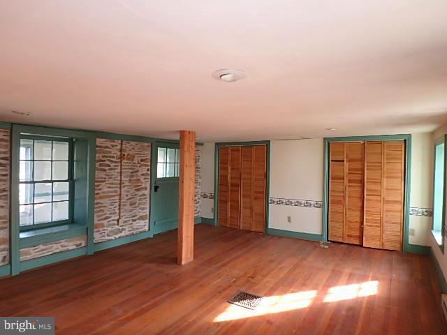 4265 Main Street Rohrersville, MD 21779 - Photo 12 of 19 an empty room with wooden floor and windows
