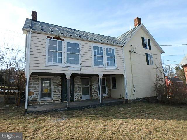 4265 Main Street Rohrersville, MD 21779 - Photo 3 of 19 a front view of a house with a garden