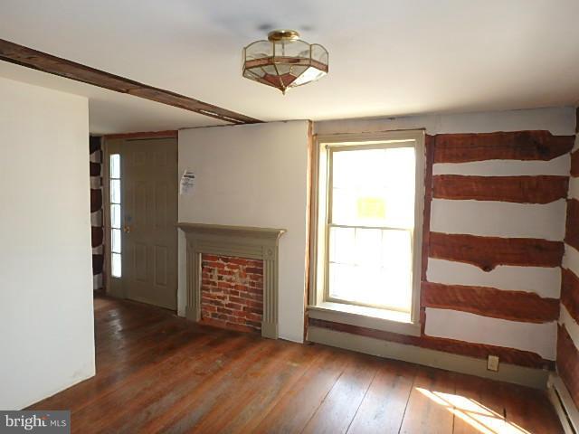 4265 Main Street Rohrersville, MD 21779 - Photo 4 of 19 a view of an empty room with a window and wooden floor