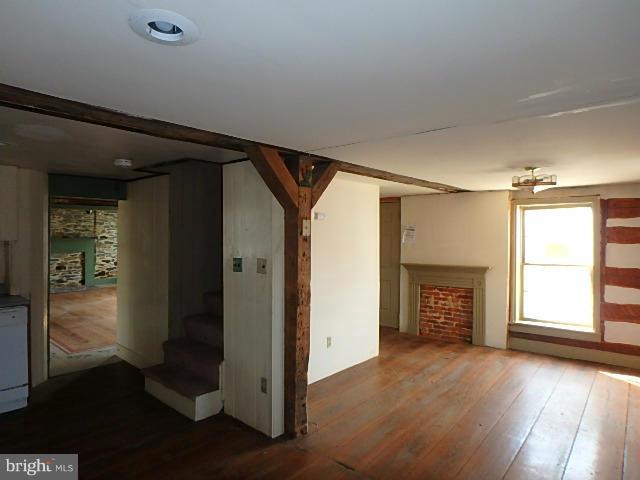 4265 Main Street Rohrersville, MD 21779 - Photo 7 of 19 a view of empty room with wooden floor and fan