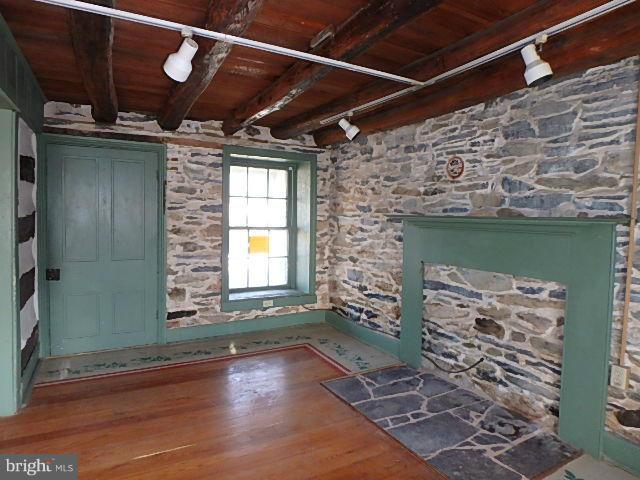 4265 Main Street Rohrersville, MD 21779 - Photo 9 of 19 a view of an empty room with a fireplace and a window