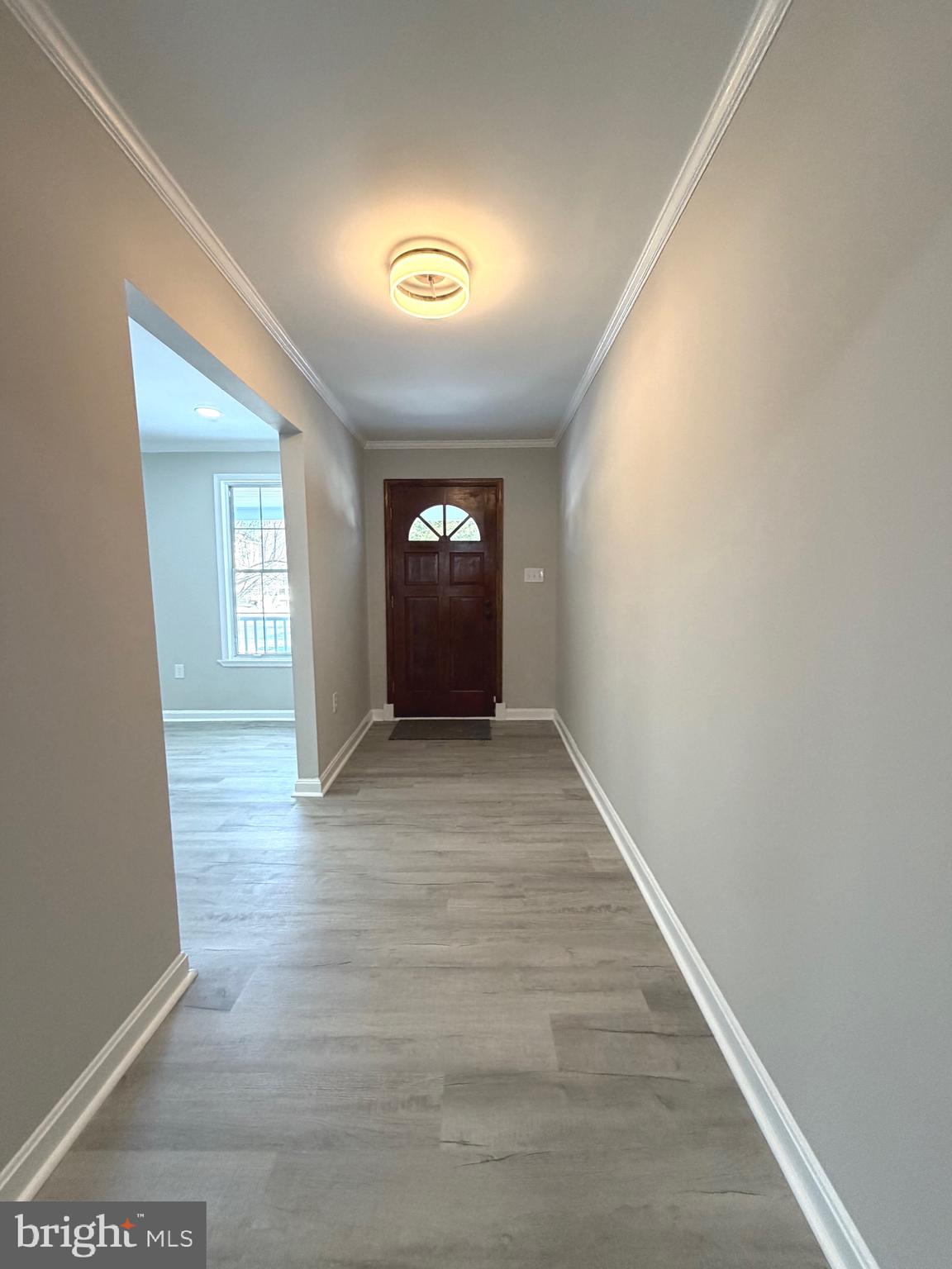 12926 Couples Place Waldorf, MD 20601 - Photo 11 of 29 a view of an empty room with window and wooden floor