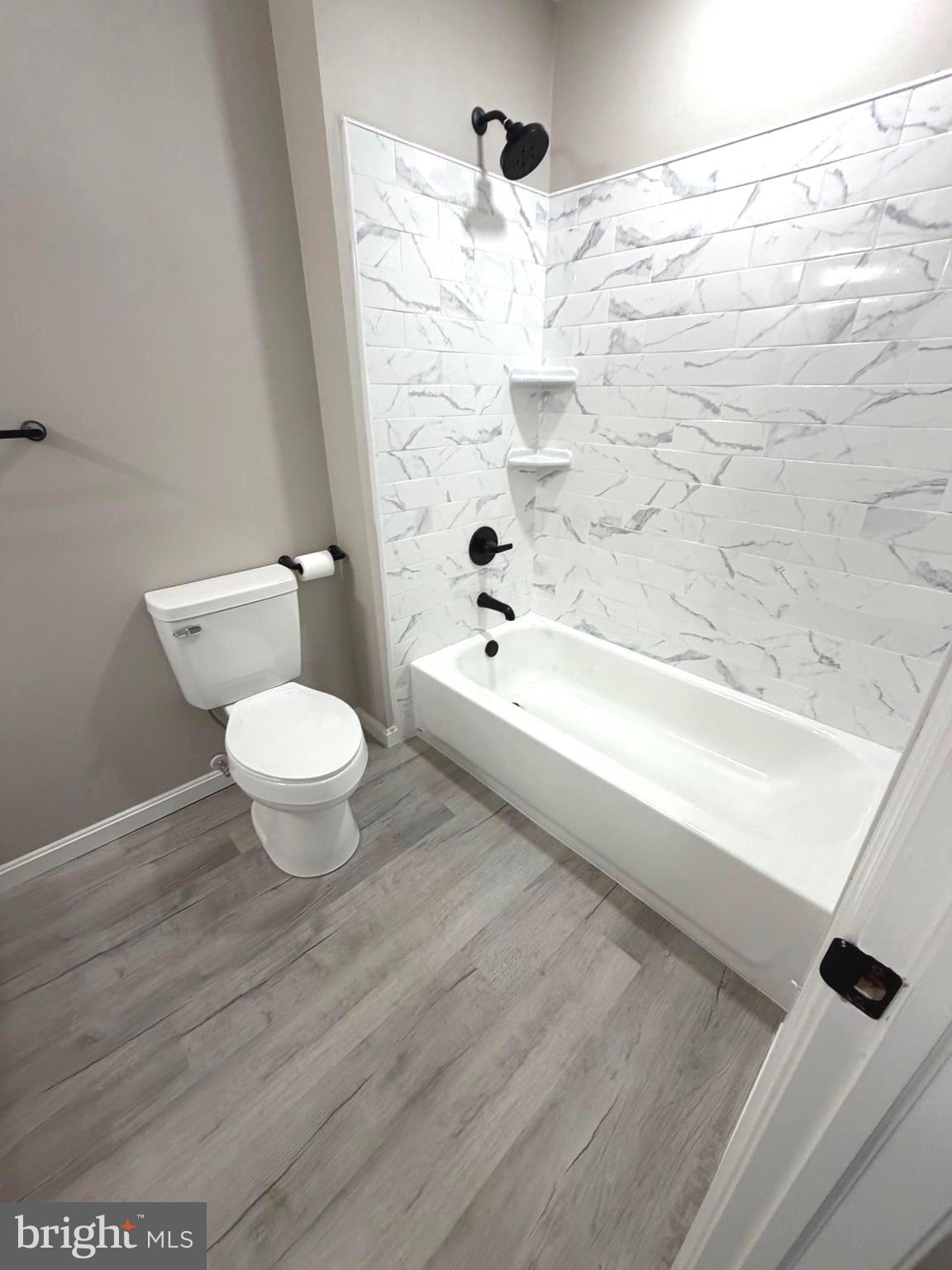 12926 Couples Place Waldorf, MD 20601 - Photo 17 of 29 a bathroom with a bathtub a toilet and a shower