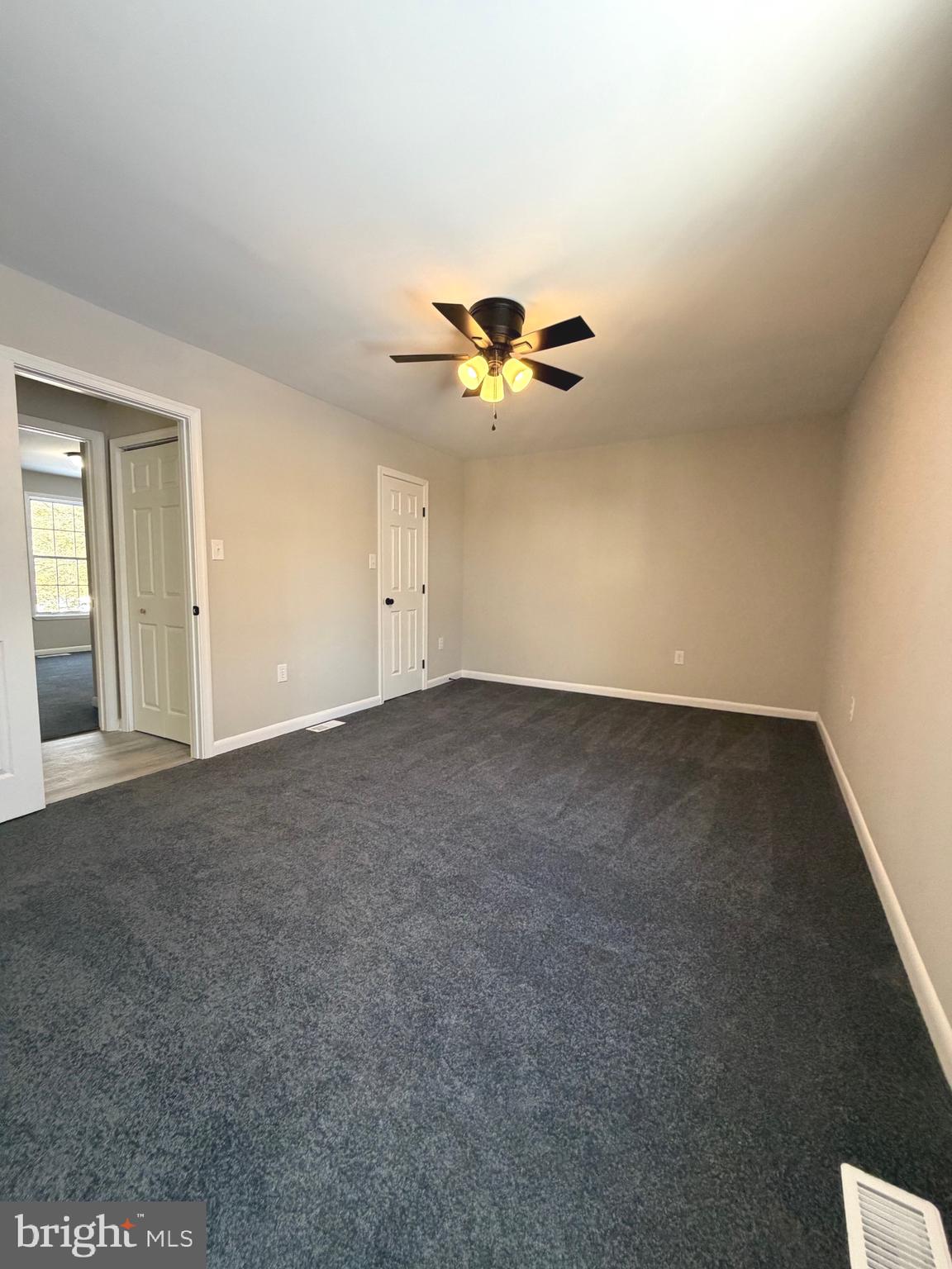 12926 Couples Place Waldorf, MD 20601 - Photo 21 of 29 a view of an empty room with a ceiling fan
