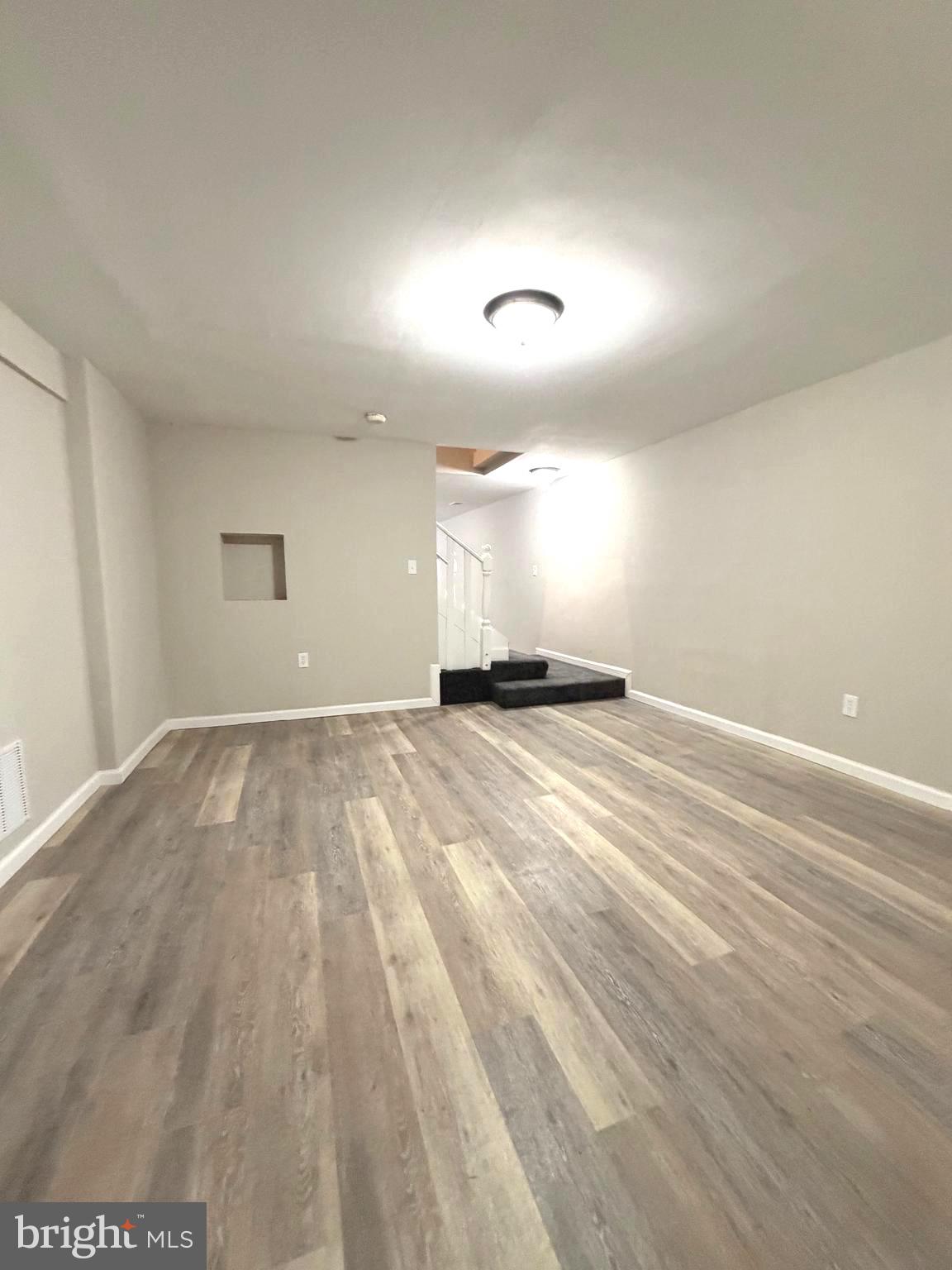 12926 Couples Place Waldorf, MD 20601 - Photo 26 of 29 a view of empty room with wooden floor
