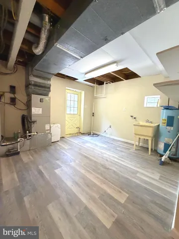 a view of a livingroom with furniture and a window