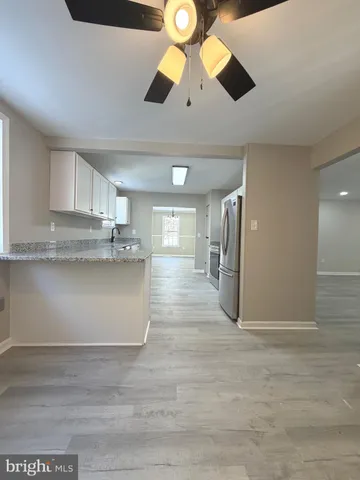 a view of a kitchen with a stove and kitchen view