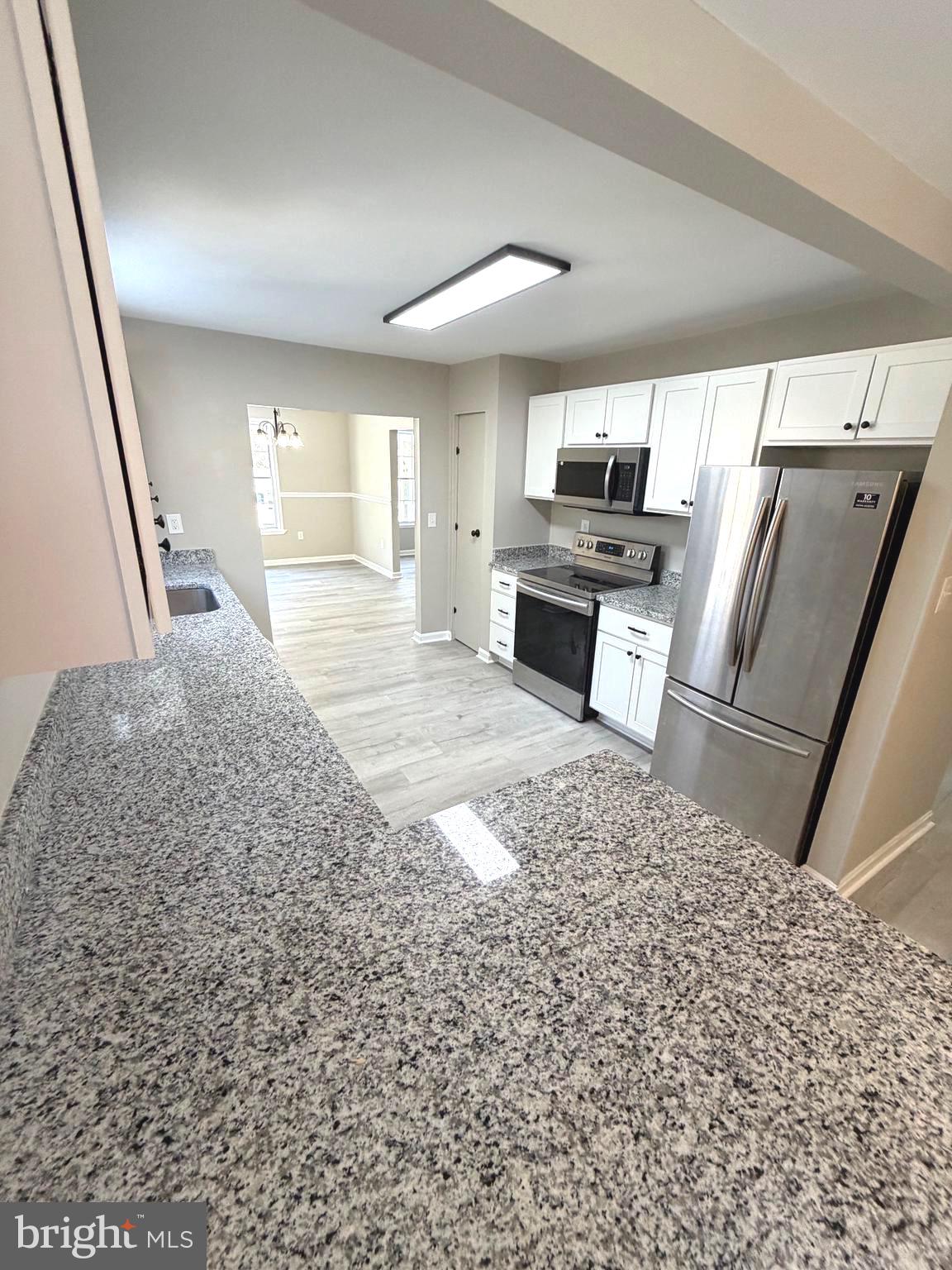 12926 Couples Place Waldorf, MD 20601 - Photo 6 of 29 a view of kitchen with sink microwave and refrigerator
