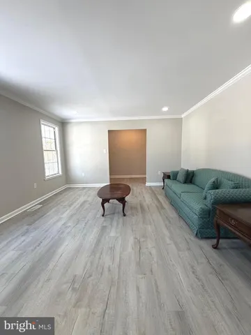 a spacious bedroom with a bed and a window