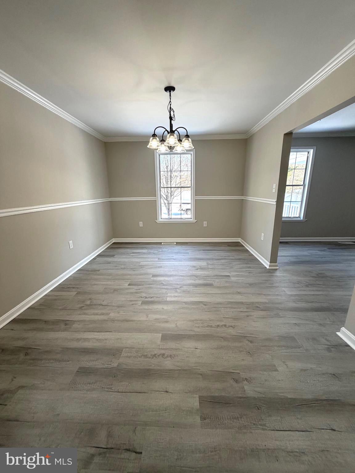 12926 Couples Place Waldorf, MD 20601 - Photo 7 of 29 a view of an empty room with window and wooden floor