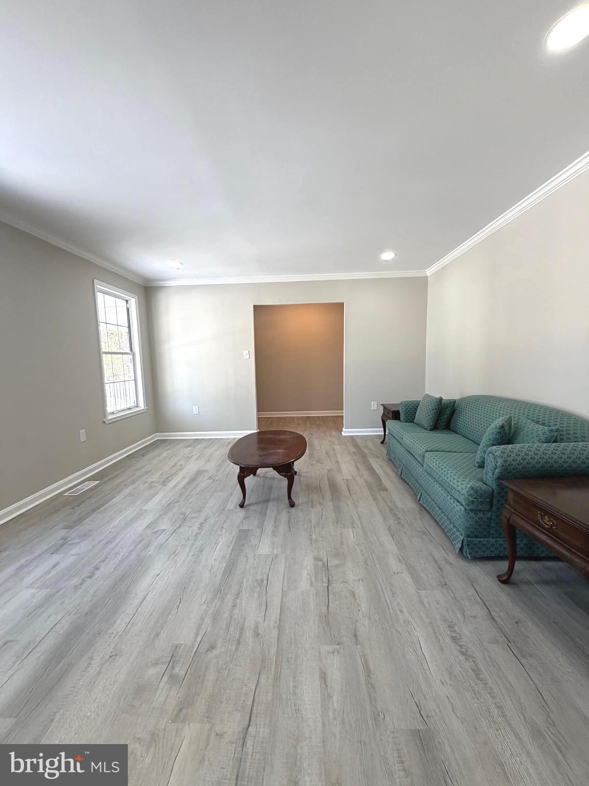12926 Couples Place Waldorf, MD 20601 - Photo 9 of 29 a spacious bedroom with a bed and a window
