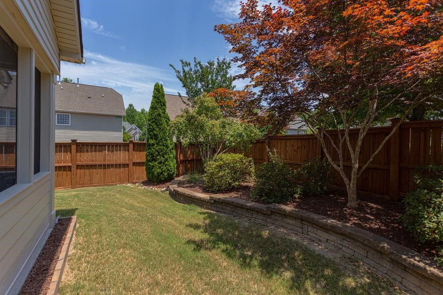 8612 Lasilla Way Raleigh, NC 27616 - Photo 21 of 27 Plantings abound in this specially design garden area, with a Crepe Myrtle, Japanese Maple and even an Apple tree to name a few. Backyard