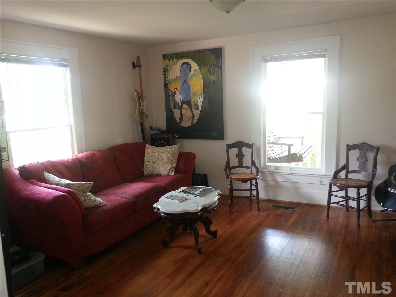 112 Camden Street Raleigh, NC 27601 - Photo 14 of 25 a living room with furniture and a large window