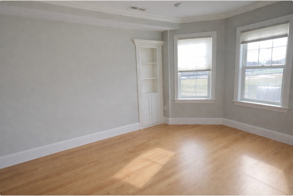33 Boardman Street, Unit 2 Boston, MA 02128 - Photo 7 of 11 an empty room with a window