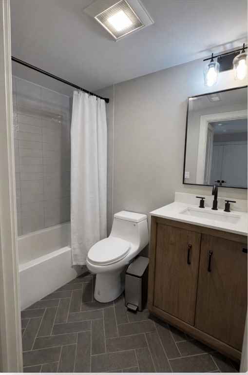 33 Boardman Street, Unit 2 Boston, MA 02128 - Photo 10 of 11 a bathroom with a sink a toilet and shower