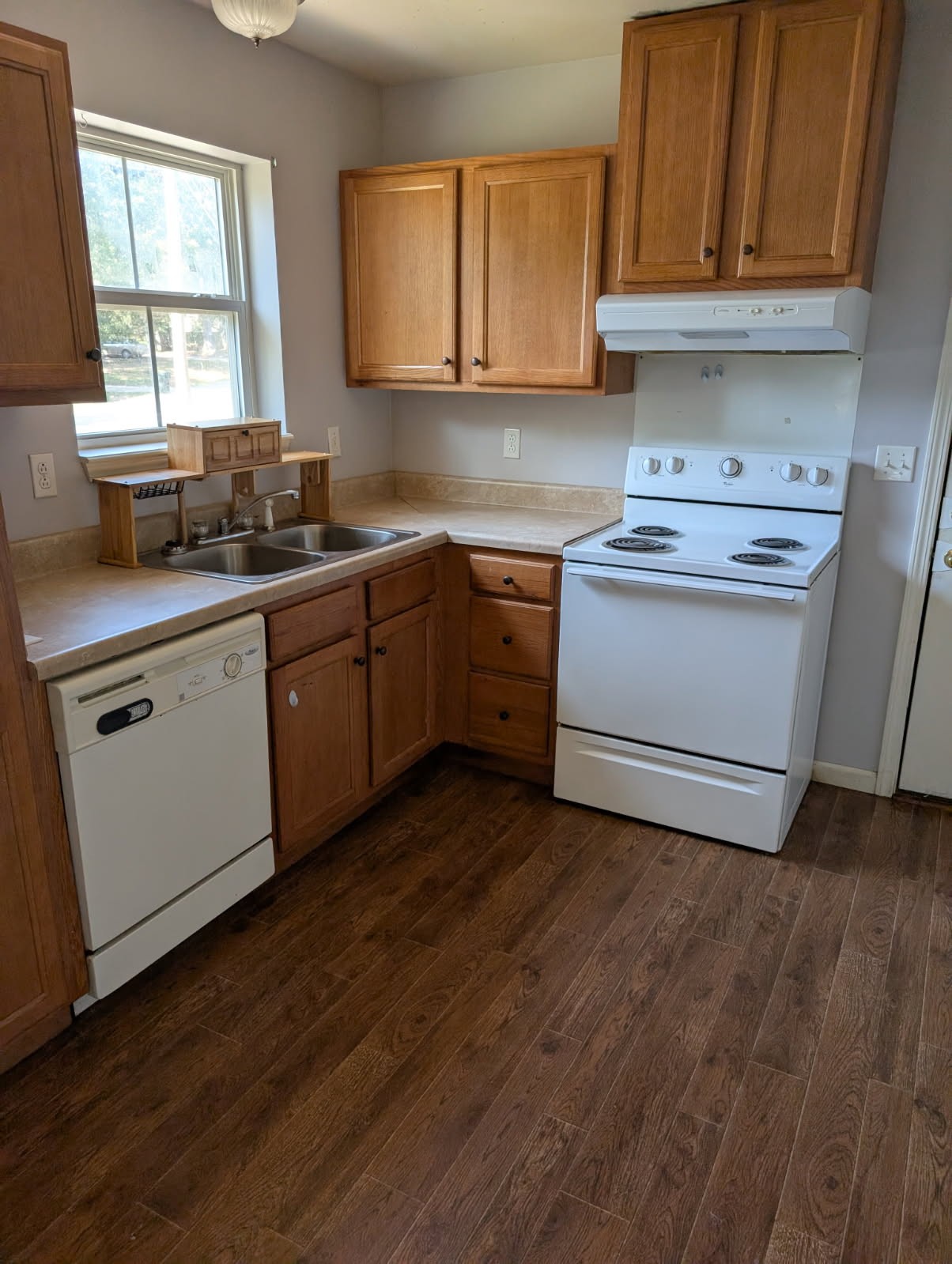 119 Silver Leaf Circle Dickson, TN 37055 - Photo 5 of 14 a kitchen with a sink cabinets wooden floor and a window