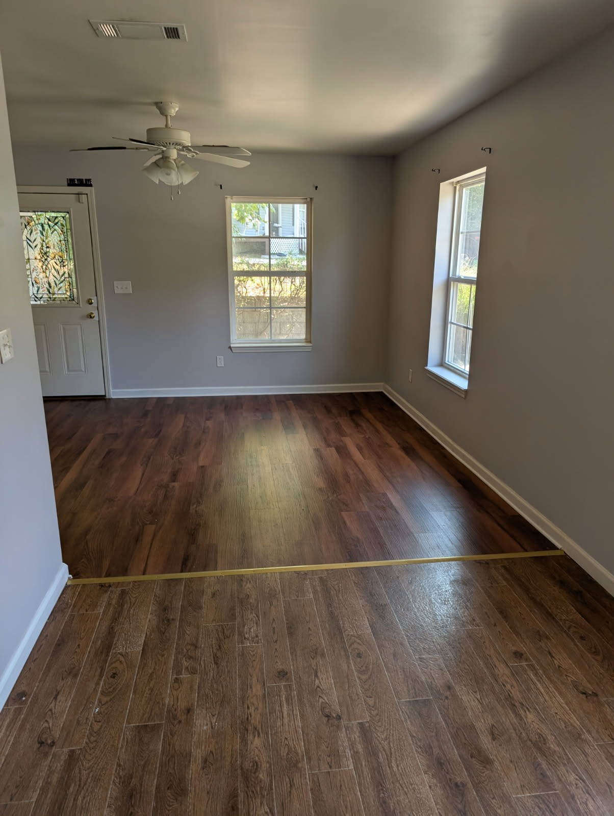119 Silver Leaf Circle Dickson, TN 37055 - Photo 8 of 14 an empty room with wooden floor and windows
