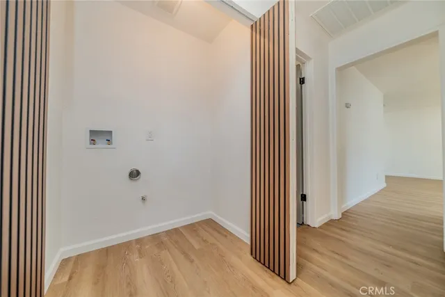 an empty room with wooden floor