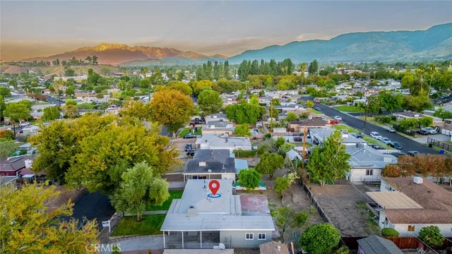 an aerial view of residential houses with outdoor space and river