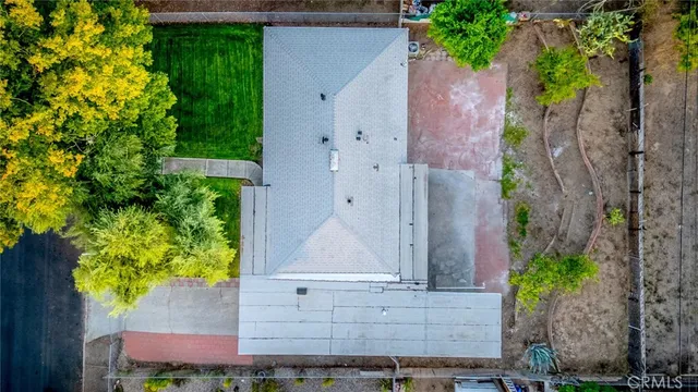 an aerial view of house with yard