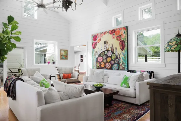 a living room with furniture and windows