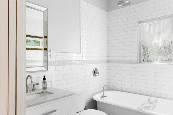 a bathroom with a toilet a sink and bathtub