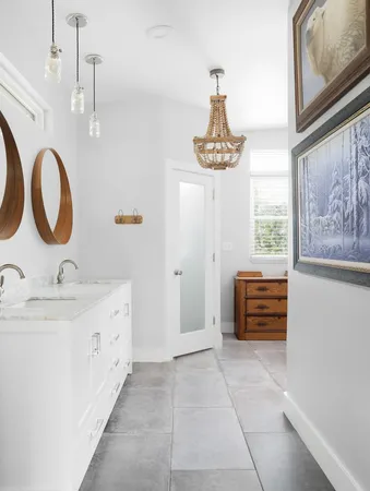 a bathroom with a sink a vanity and a mirror