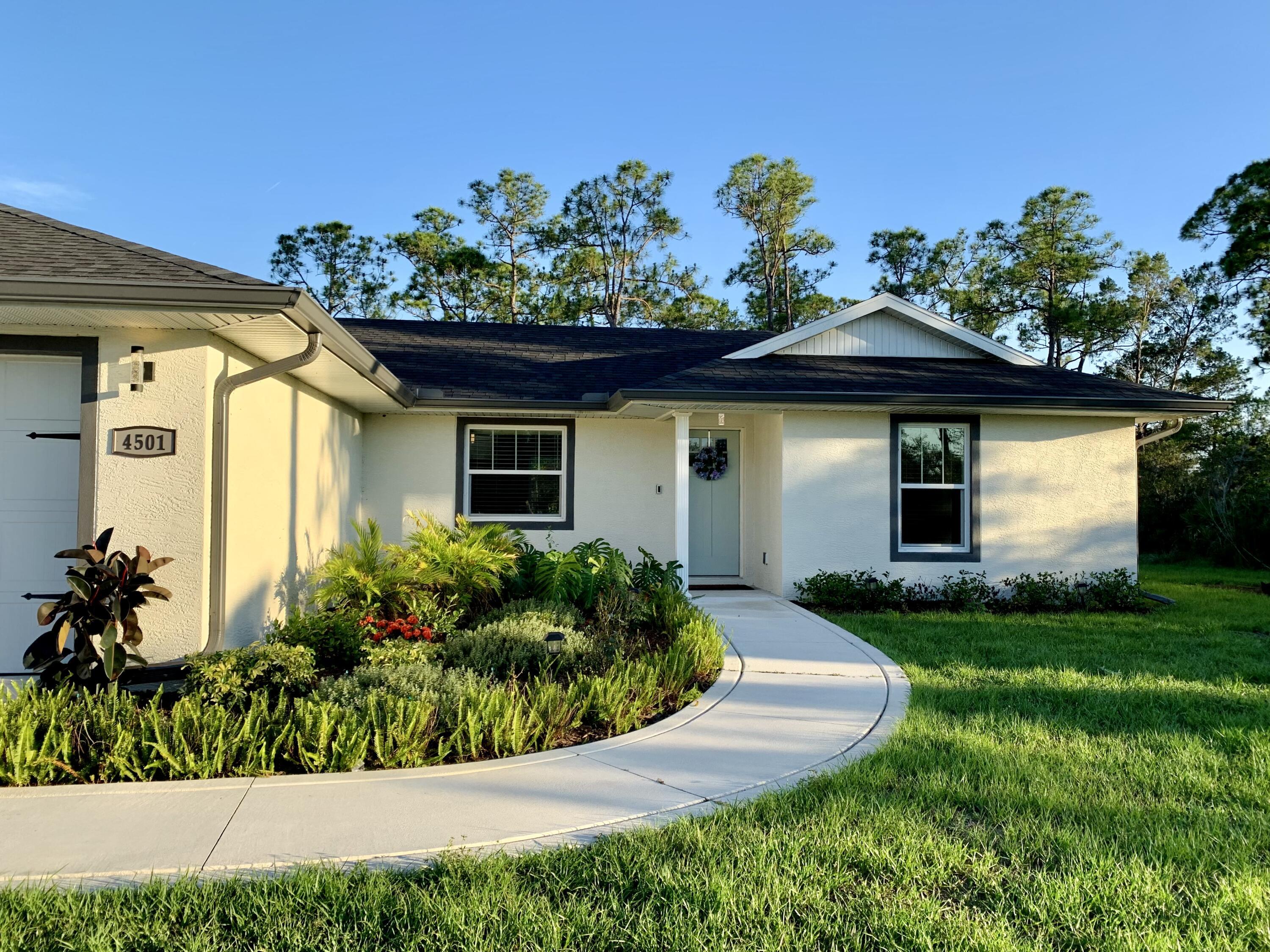 4501 Talbot Street Sebring, FL 33872 - Photo 3 of 28 a front view of a house with a porch