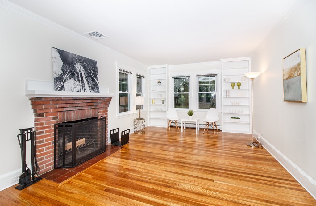 55 Wilde Road Newton, MA 02468 - Photo 12 of 30 a living room with furniture and a fireplace