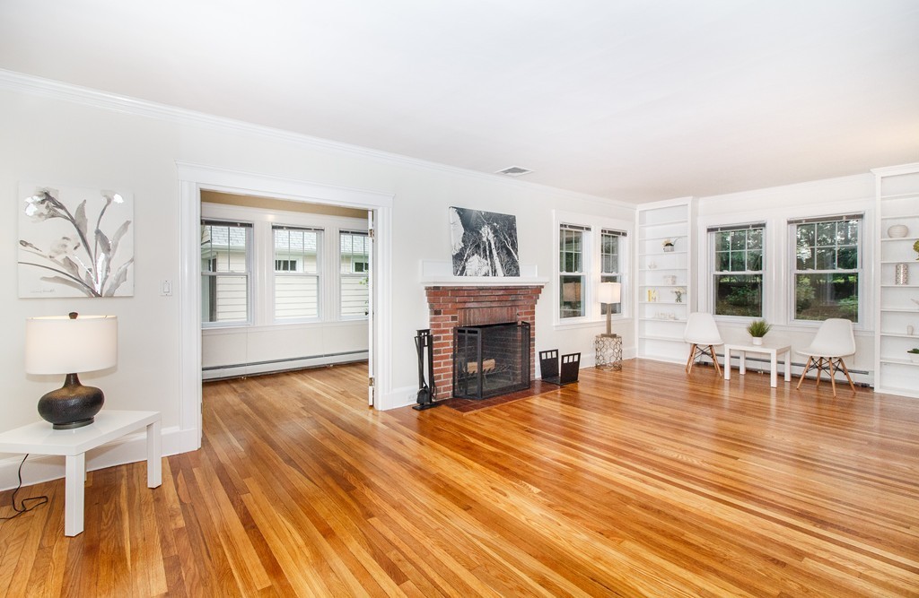 55 Wilde Road Newton, MA 02468 - Photo 13 of 30 a living room with furniture and a fireplace