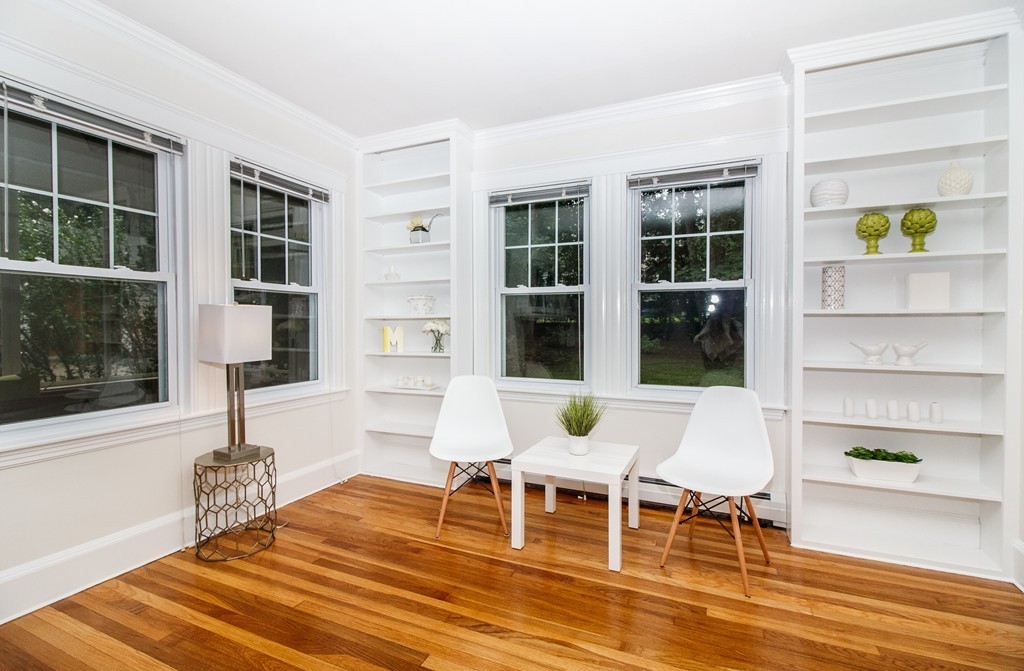 55 Wilde Road Newton, MA 02468 - Photo 14 of 30 a dining room with a table and chairs