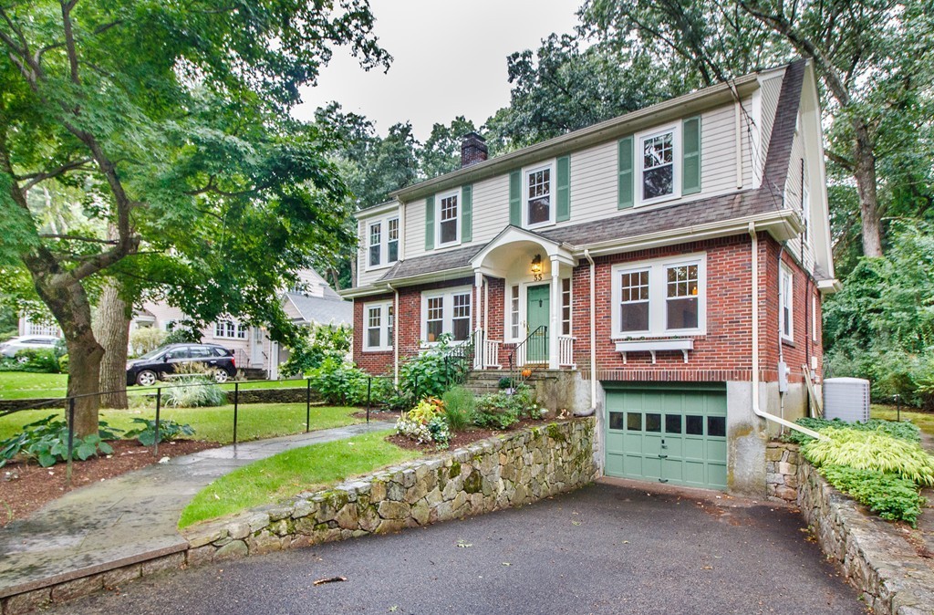 55 Wilde Road Newton, MA 02468 - Photo 2 of 30 a front view of a house with a yard and porch