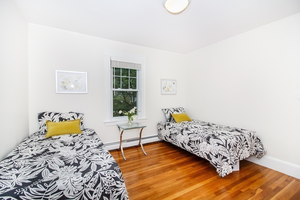 55 Wilde Road Newton, MA 02468 - Photo 26 of 30 a bedroom with a bed and wooden floor