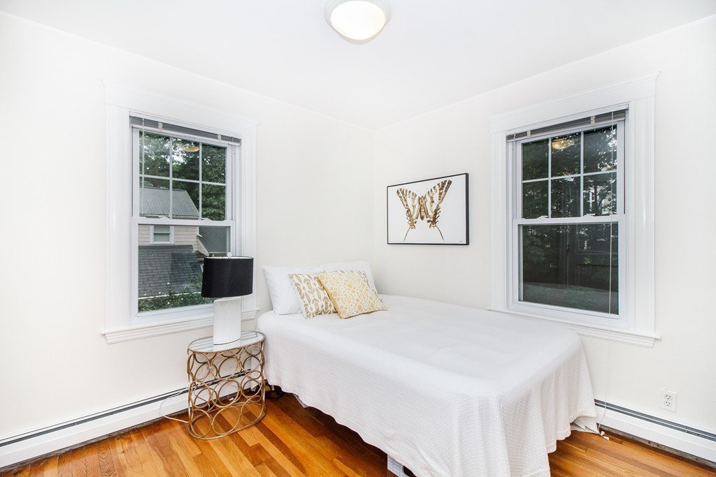 55 Wilde Road Newton, MA 02468 - Photo 27 of 30 a bedroom with a bed and wooden floor