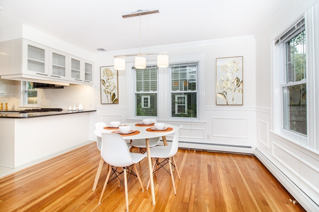 55 Wilde Road Newton, MA 02468 - Photo 6 of 30 a dining room with a table and chairs