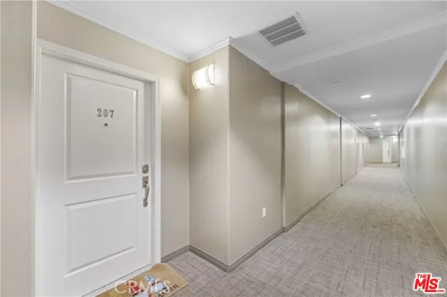 a view of hallway with livingroom