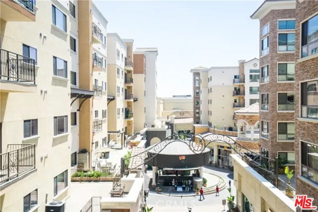 a couple of cars parked in front of buildings
