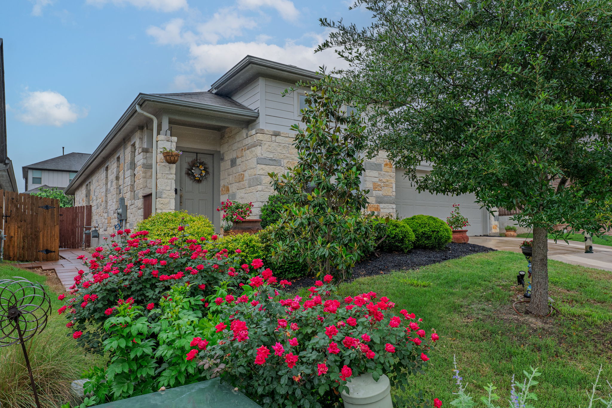 1009 Goldilocks Lane Manchaca, TX 78652 - Photo 1 of 40 Stone veneer exterior featuring a covered entry.