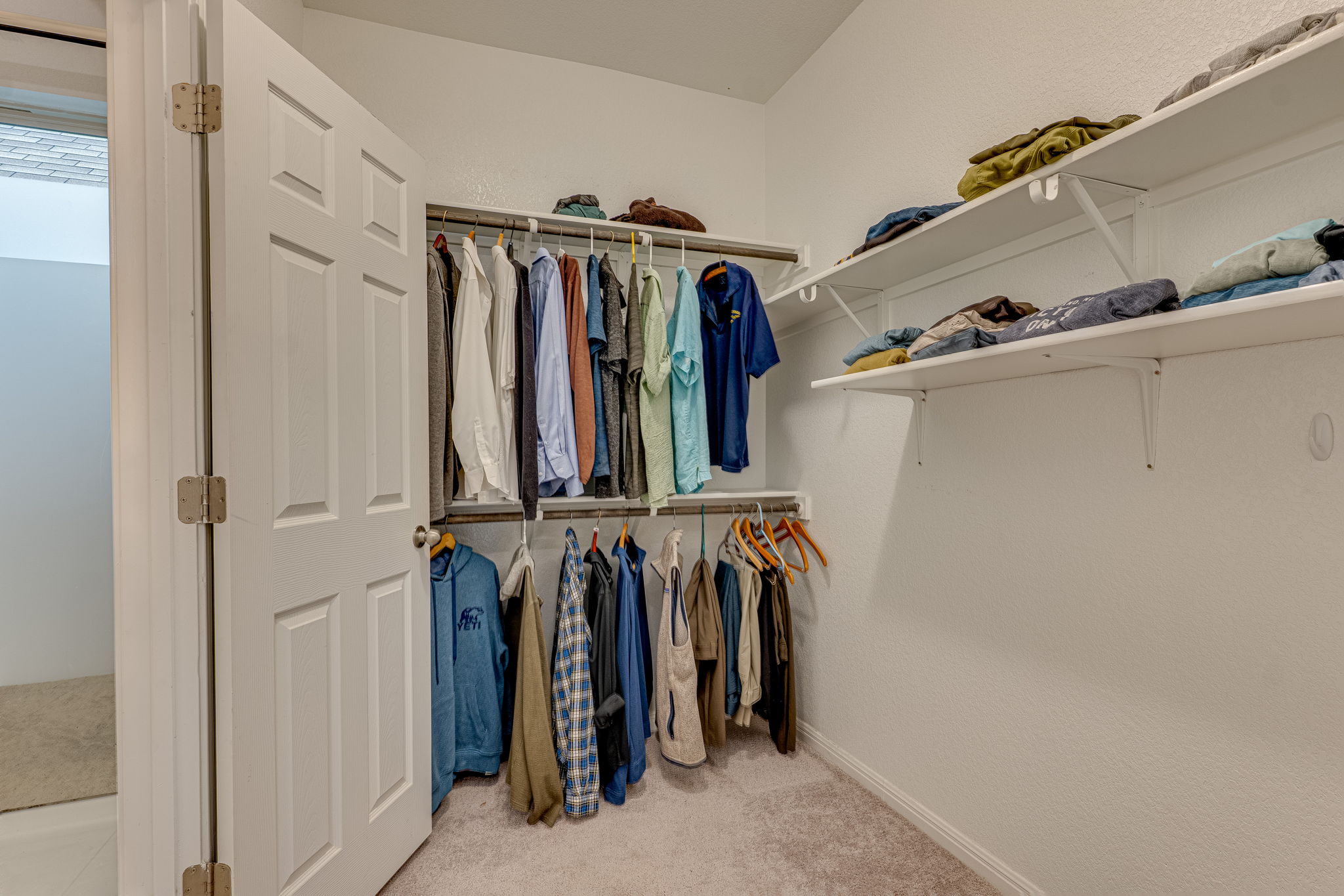 1009 Goldilocks Lane Manchaca, TX 78652 - Photo 24 of 40 Second walk-in closet in the primary suite that connects to the utility room.