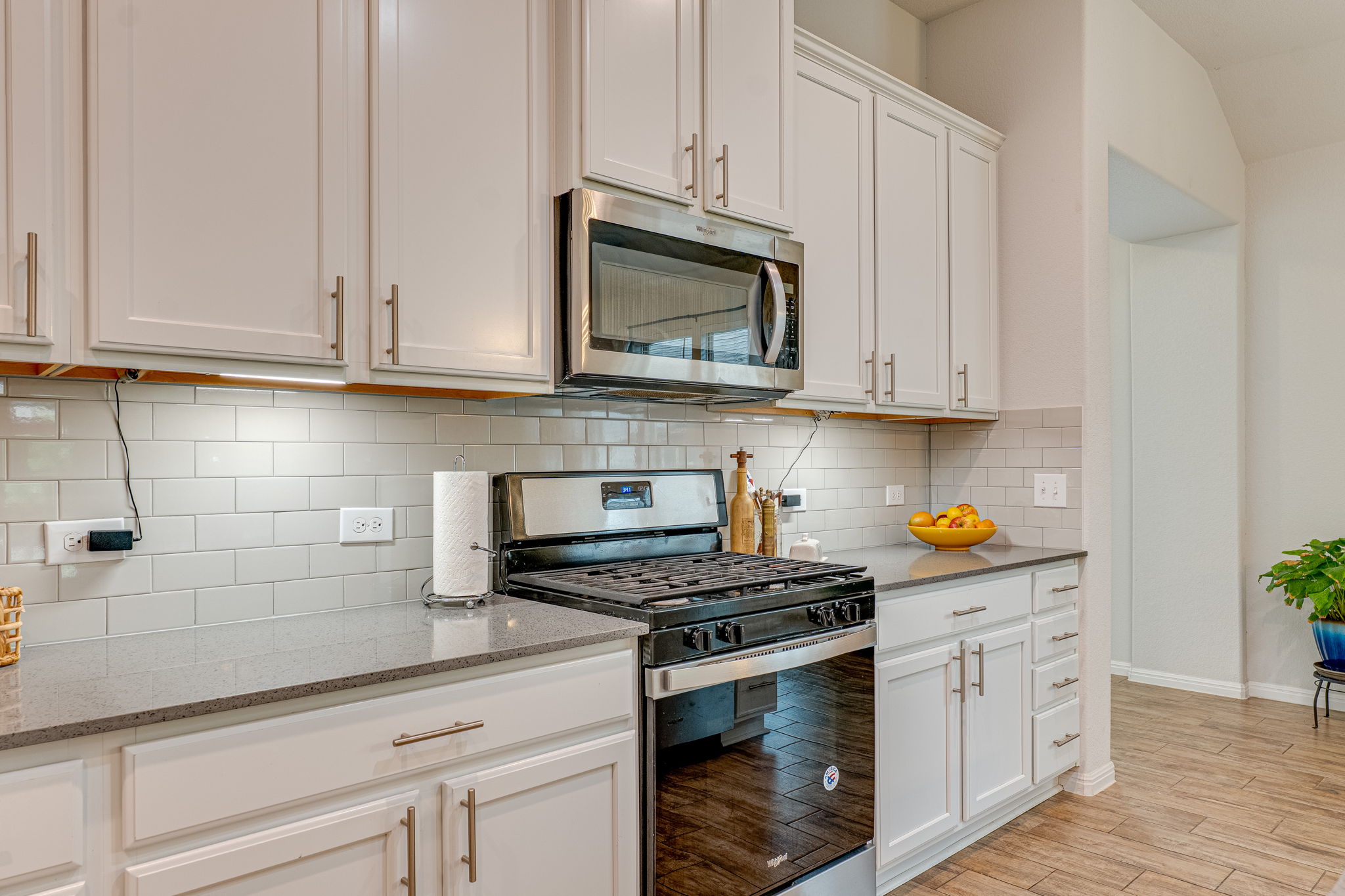 1009 Goldilocks Lane Manchaca, TX 78652 - Photo 7 of 40 Kitchen featuring a stainless steel gas range and built-in microwave.