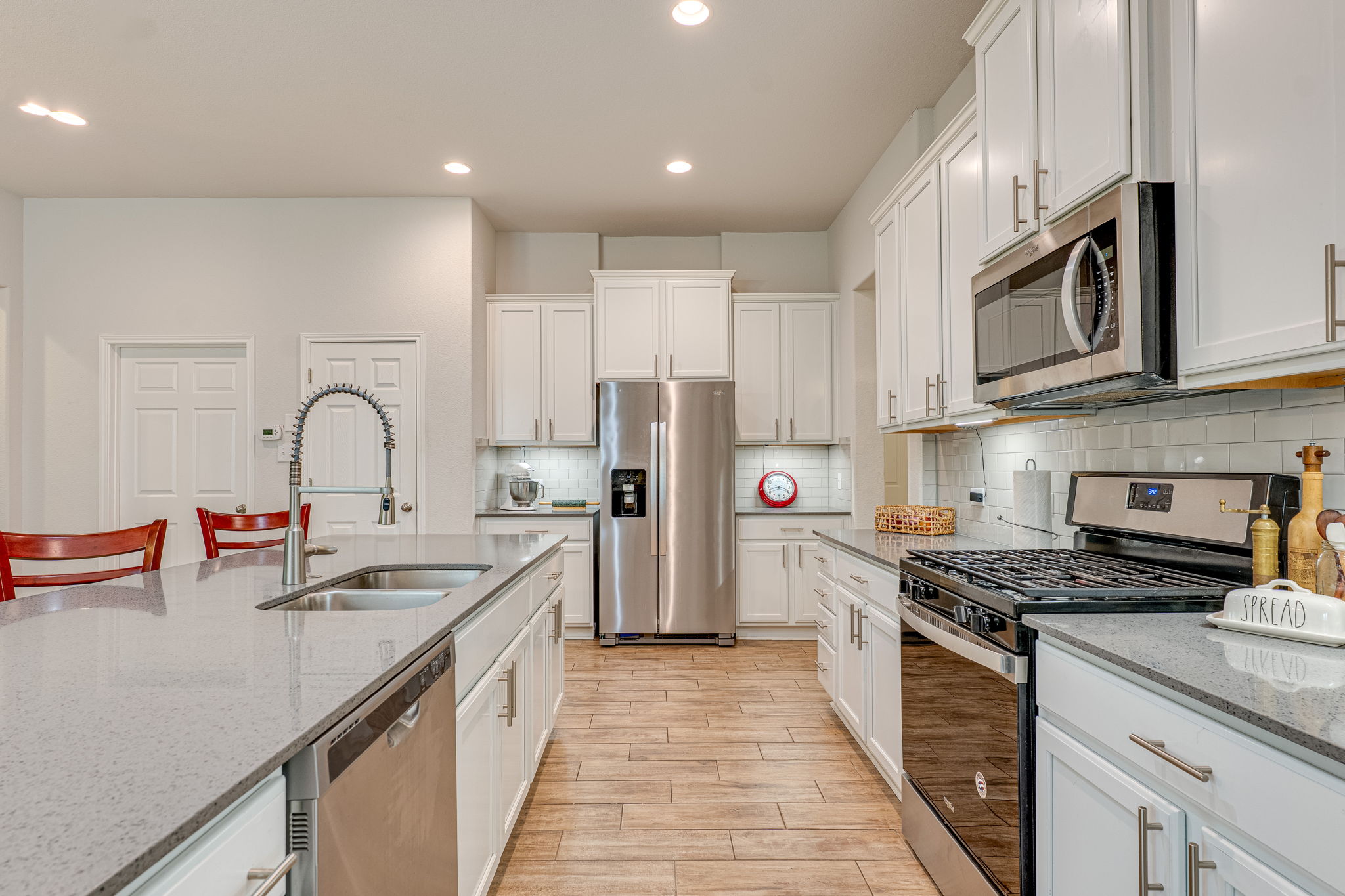 1009 Goldilocks Lane Manchaca, TX 78652 - Photo 8 of 40 Spacious kitchen featuring an spacious center island with a double basin sink and gooseneck faucet.