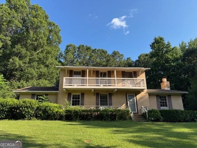 15316 Concord Street Zebulon, GA 30295 - Photo 1 of 1 a front view of a house with a yard