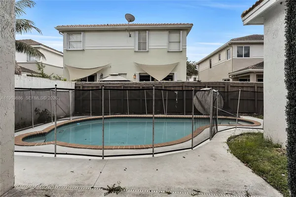 a view of a backyard with a patio