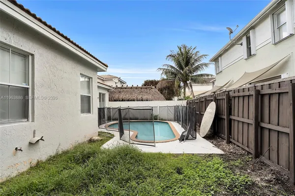 a view of a back yard of the house