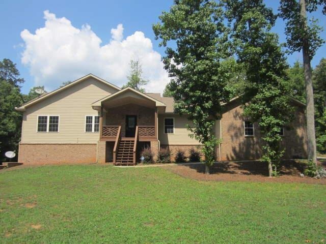 754 Pine Needle Road Hampton, GA 30228 - Photo 1 of 1 a front view of house with yard and green space