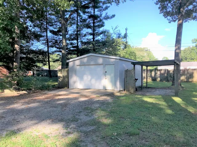 a view of a back yard of the house